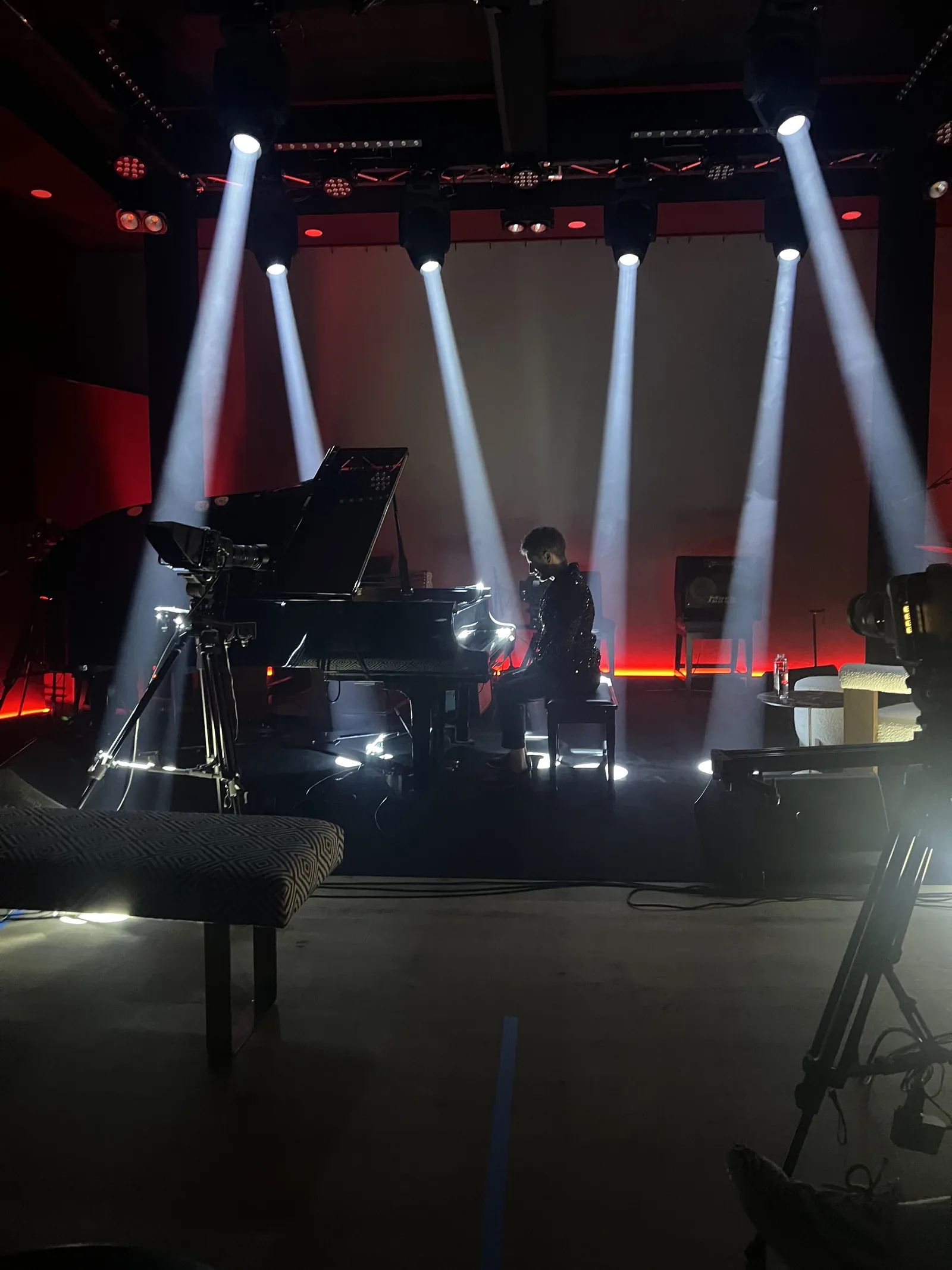 Light beams over the grand piano at The Recording Club
